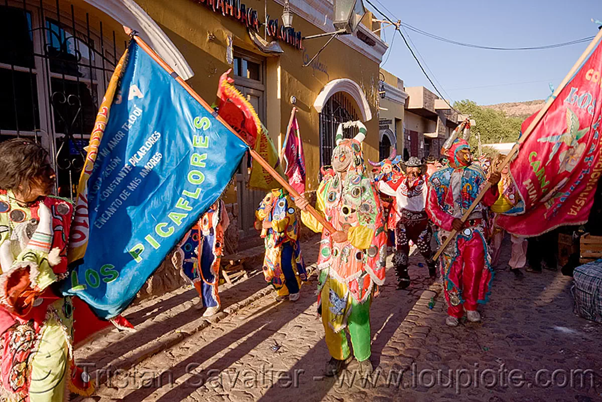 diablos de la comparsa de los picaflores - carnaval de humahuaca (argentina), carnival, costume, diablo carnavalero, diablo de carnaval, flag, folklore, horns, man, mask, mirrors, noroeste argentino, quebrada de humahuaca, tribal, stock photo