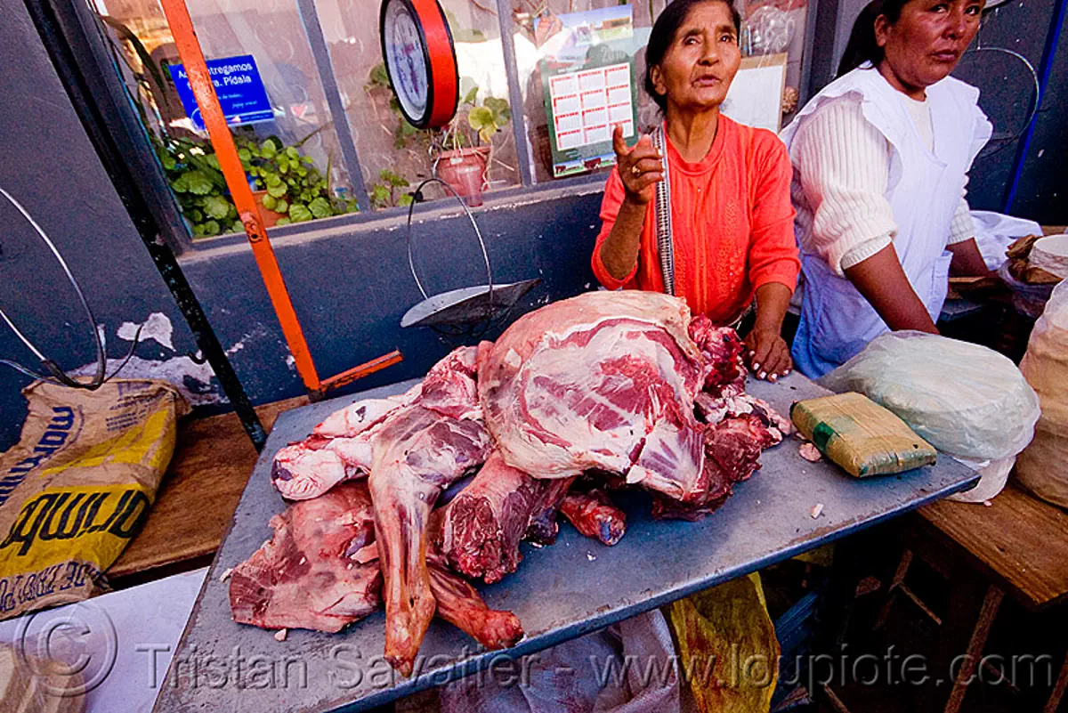 llama meat - street market (argentina), butcher, carnaval, carnival, meat shop, noroeste argentino, quebrada de humahuaca, raw meat, street vendor, stock photo
