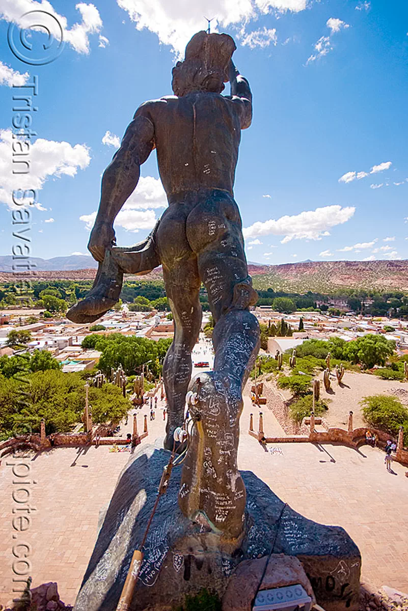 statue at the top of the monumento a los H&egrave;roes de la independencia - humahuaca (argentina), bronze, graffiti, monument to independence, monumento a la idependencia, monumento a los h&egrave;roes de la independencia, noroeste argentino, quebrada de humahuaca, sculpture, the heroes monument of independence, stock photo