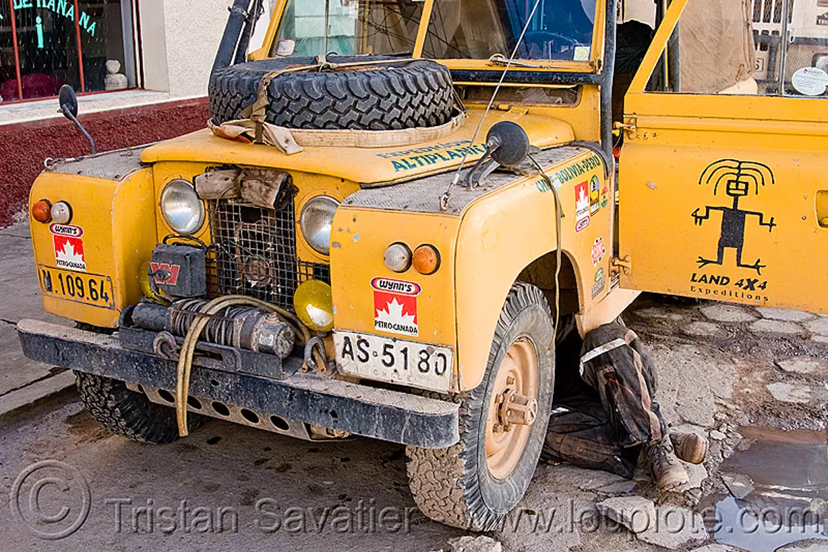 land rover series II, 4wd, 4x4, car, expedition, front, legs, man, mechanic, pto winch, truck, under, uyuni, yellow