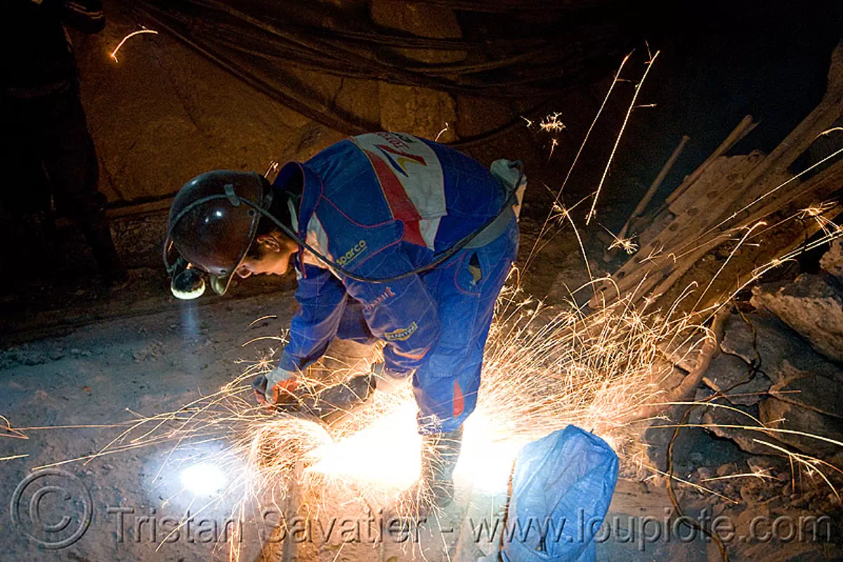 miner grinding metal