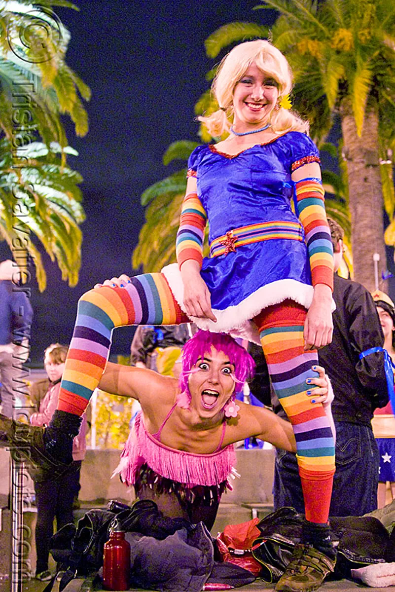 rainbow brite costume, brihannala, embarcadero, halloween, journey to the end of the night, justin herman plaza, purple hair, rainbow brites, rainbow colors, rainbow stockings, rainbow tights, sara, women, stock photo