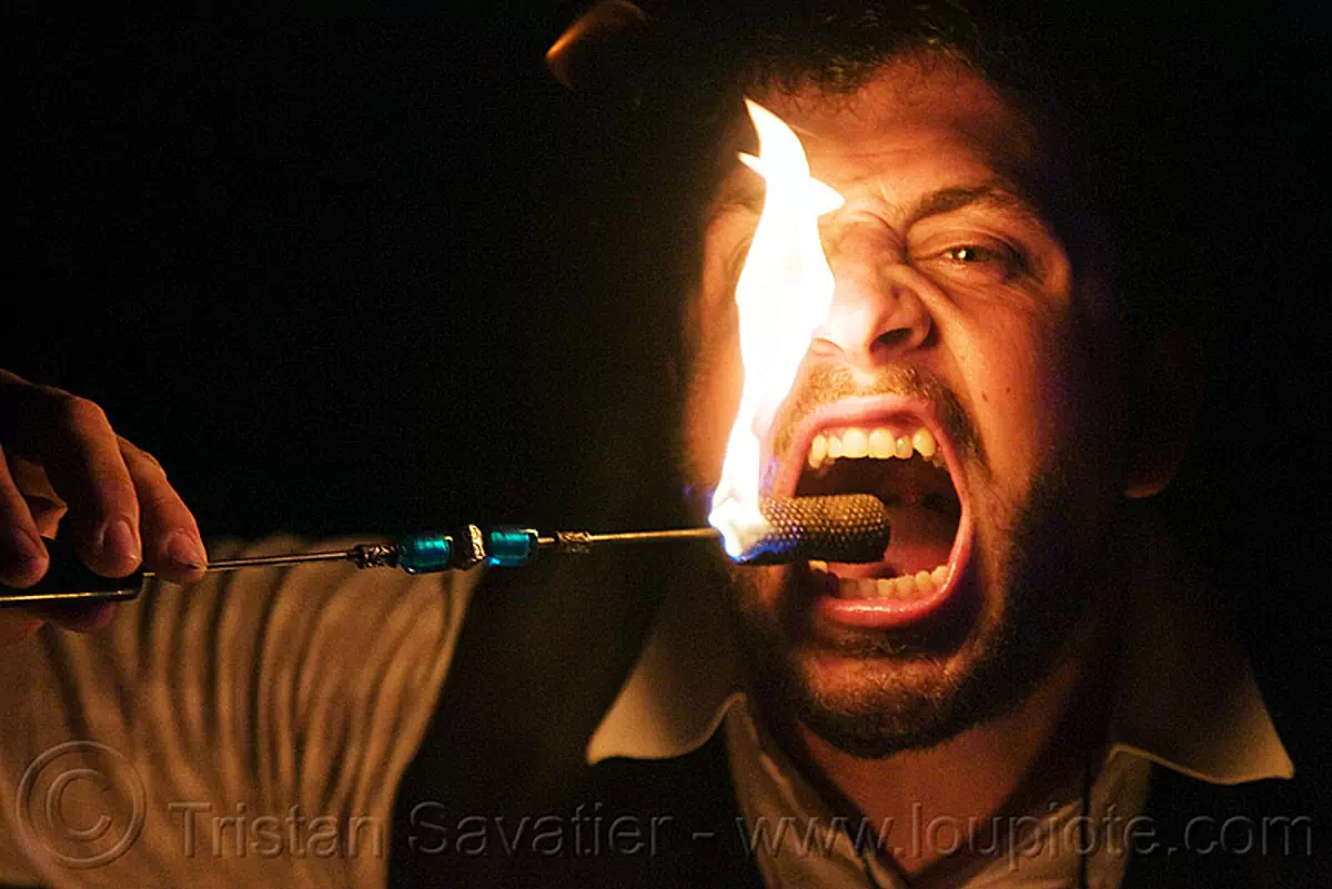 fire eater, eating fire, fire dancer, fire dancing, fire eating, fire performer, flame, labyrinth under the mask, mouth, night, teeth, stock photo