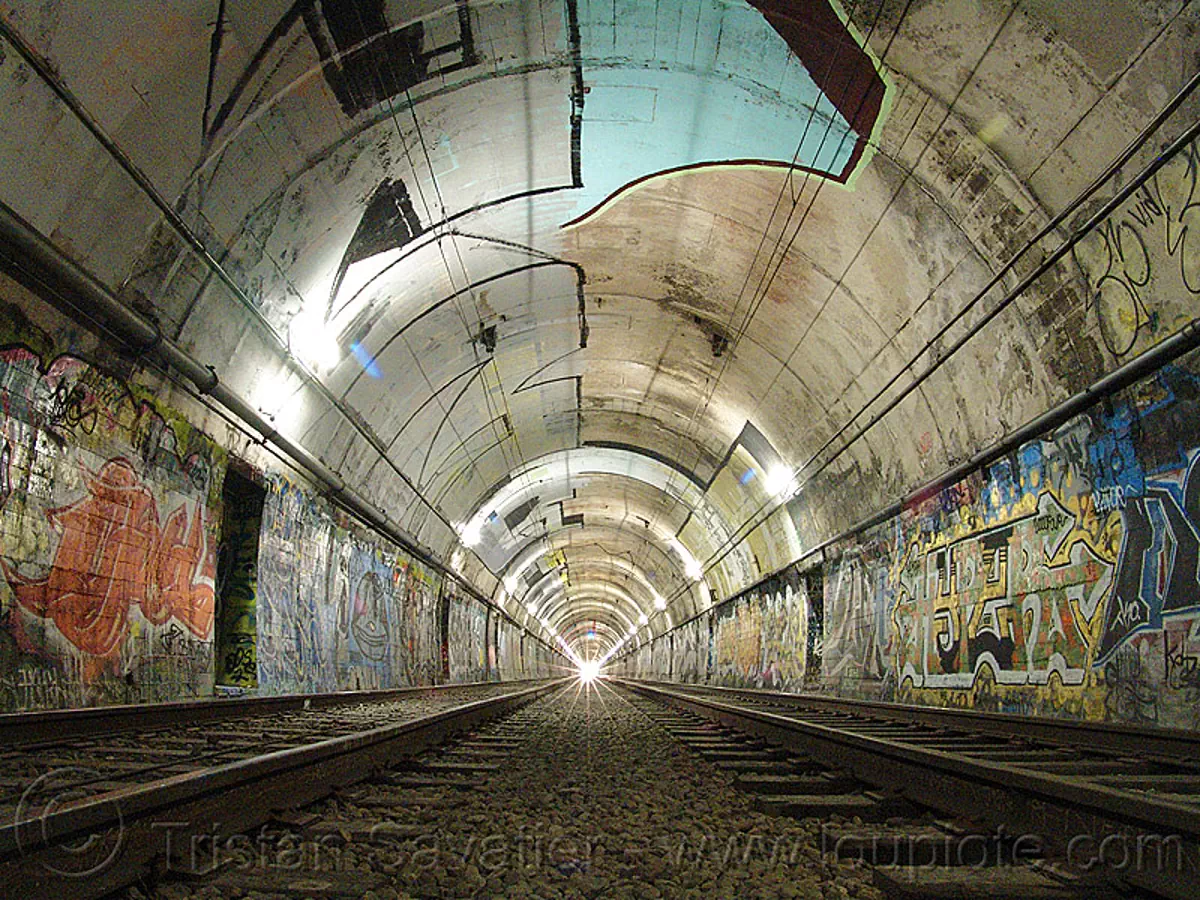train tunnel, danger, dangerous, duboce tunnel, graffiti, light rail, metro, muni subway, no trespassing, perspective, rail tracks, railroad tracks, rails, san francisco municipal railway, street art, sunset tunnel, train tracks, urban exploration, vanishing point, stock photo
