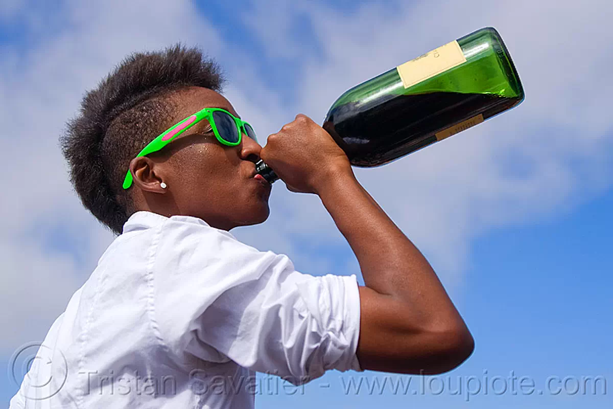 drinking wine at the bottle, arm, dolores park, gay pride festival, mohawk hair, sunglasses, zh&uacute;, stock photo