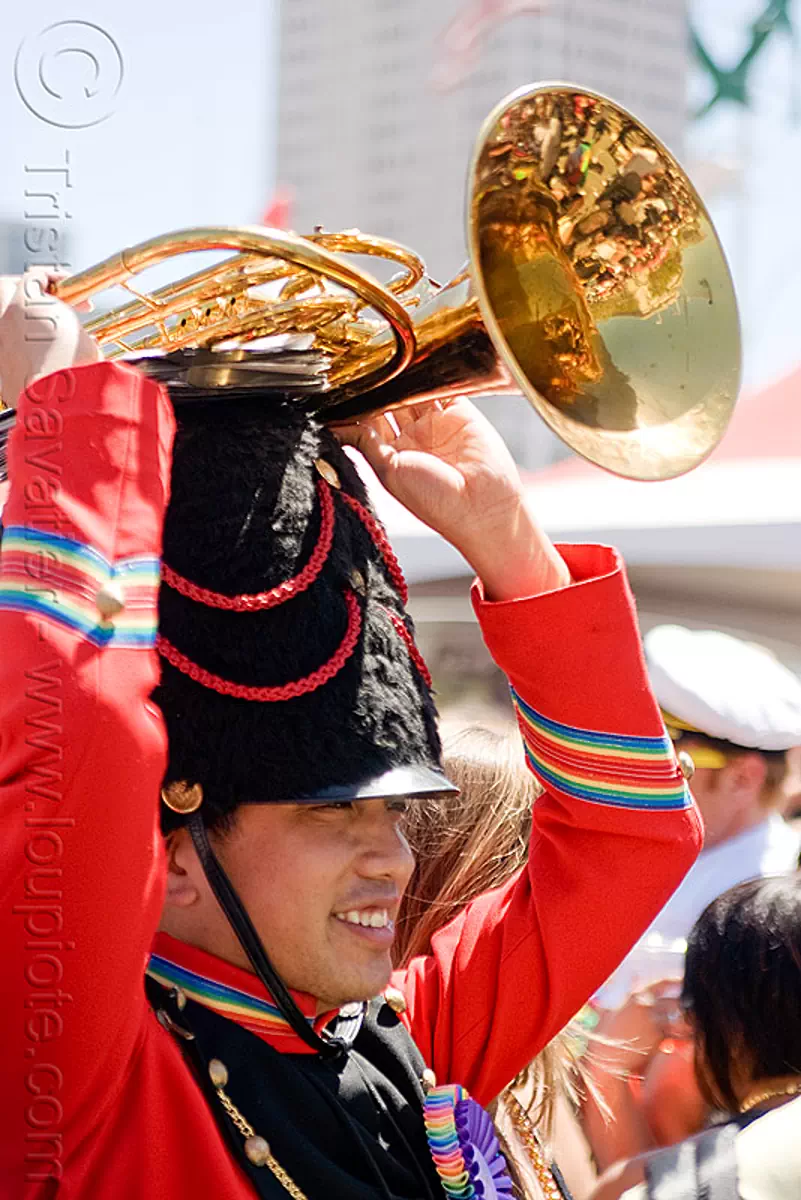 sax-horn player red marching band uniform, daxhorn, gay pride festival, man, rainbow colors, stock photo