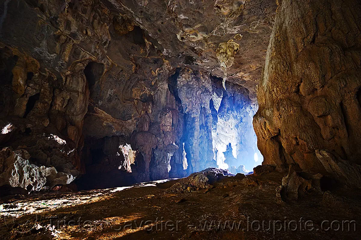 exploring fairy cave (borneo), backlight, bau, cave formations, caving, concretions, natural cave, speleothems, spelunking, stalactites, stock photo