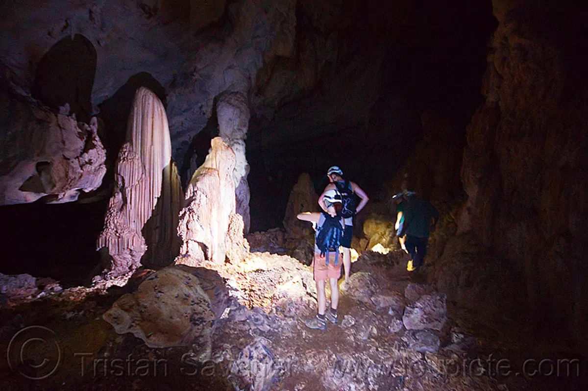 stalagmites - cave formations - caving in mulu (borneo), cavers, clearwater cave system, clearwater connection, concretions, gunung mulu national park, natural cave, speleothems, spelunkers, spelunking, stalagmite, stock photo