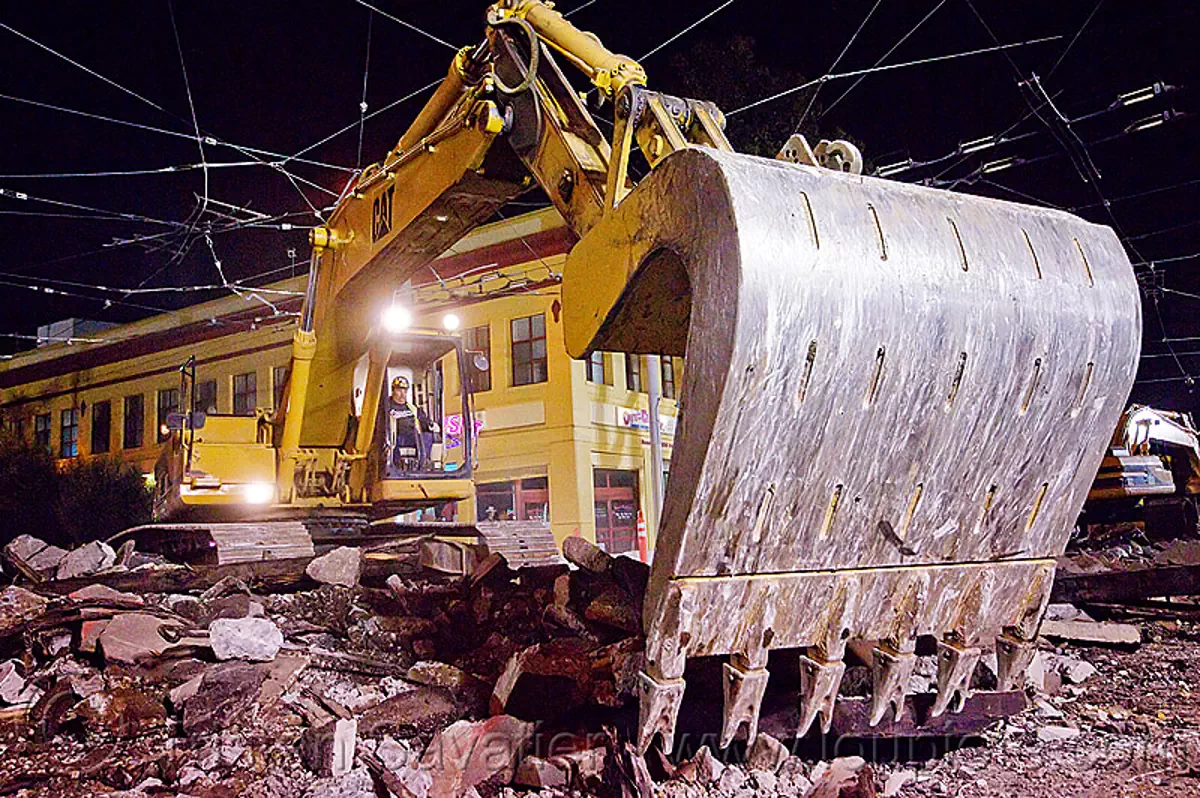 caterpillar 326L excavator, bucket attachment, cat 326l, demolition, light rail, machinery, muni, night, ntk, overhead lines, railroad construction, railroad tracks, rails, san francisco municipal railway, track maintenance, track work, stock photo