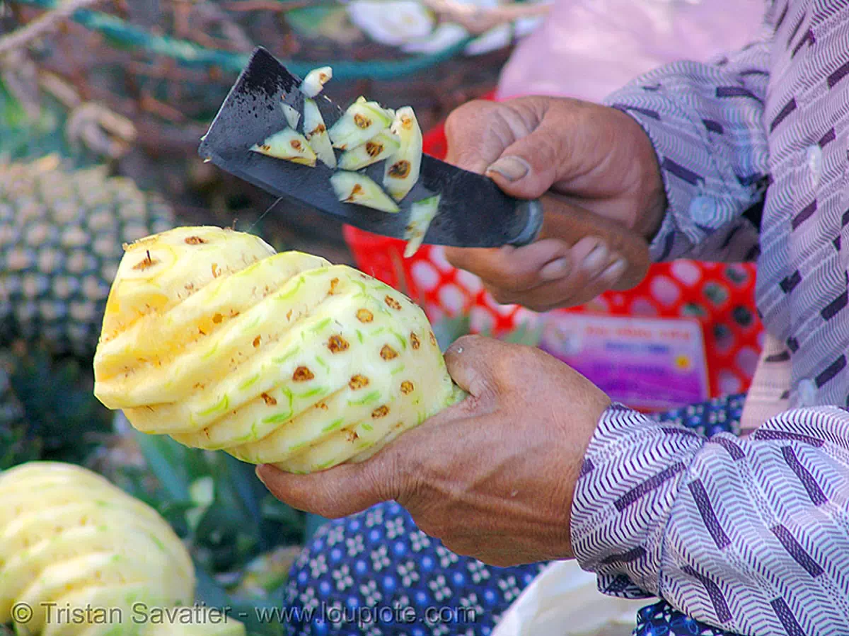 pineapple carving, carved, knife, market, stock photo