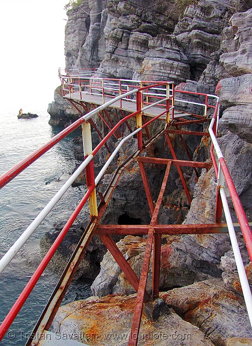 catwalk along sea cliff - vietnam, cat ba island, cat walk, c&aacute;t b&agrave;, metal, ocean, red, risted, rocks, rusted, rusty, seashore, shore, trespassing, white, stock photo