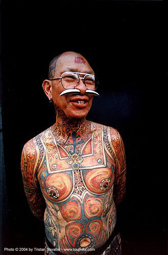 Tattooed man with Septum nose piercing (Howard street, San Francisco)
