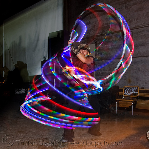 sexy-bitch spinning a LED hula hoop