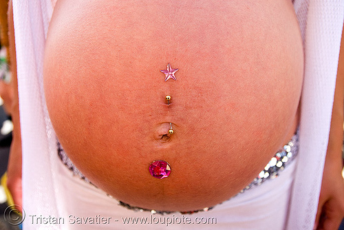pregnant woman with navel piercing