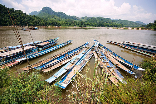 boats on mekong river near luang prabang (laos)