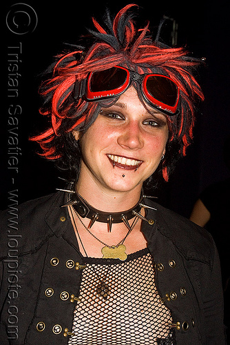 red hair girl with spiky necklace