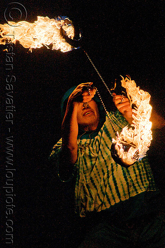 fire performer spinning poi - temple of poi 2009 fire dancing expo - union square (san francisco)
