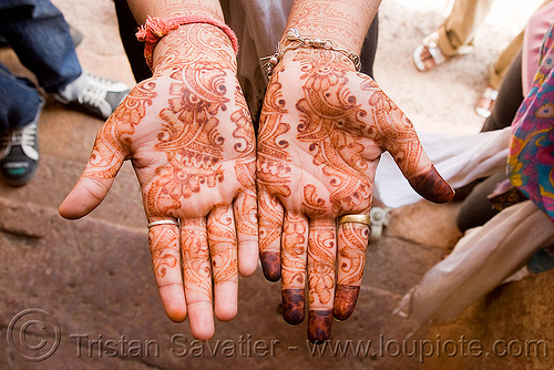hands with mehndi henna temporary tattoo india 