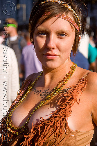 woman with chest tattoo cleavage festival love fest LovEvolution 