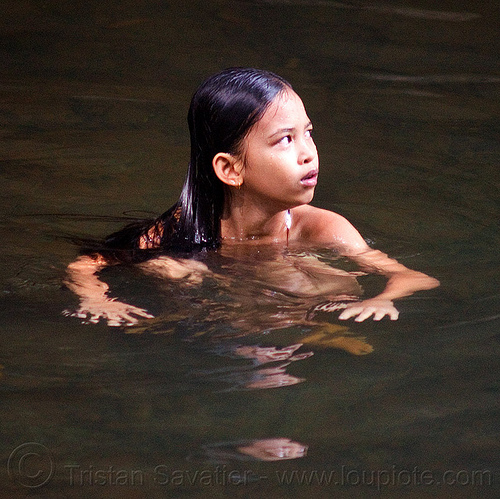 young girl bathing in river