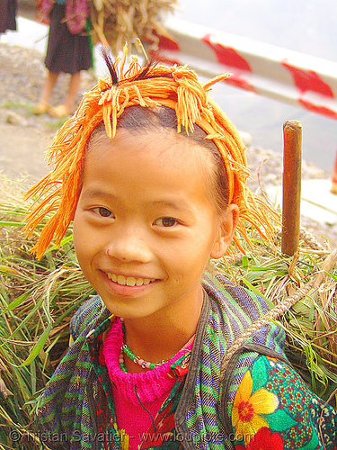 tribe girl carrying grass - vietnam