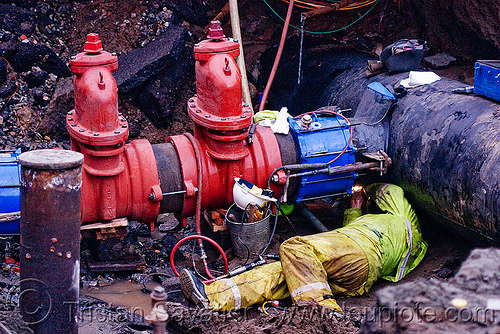arc welding - c515 cut-off valves - utility worker fixing broken water main (san francisco), awwa c515, construction worker, contractor, crawling, cut-off valves, gate valves, hetch hetchy water system, high-visibility vest, reflective vest, repairing, resilient, safety helmet, safety vest, sfpuc, sink hole, utility crew, utility worker, water department, water main, water pipe, welder, welding, workers