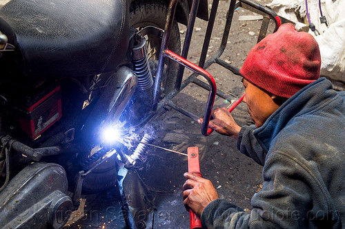 arc welding repair on motorcycle (india), 350cc, arc welding, fixing, luggage rack, man, mechanic, motorcycle, repairing, royal enfield bullet, sikkim, thunderbird, welder, worker, working