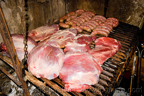 asado - meat and chorizo barbecue, argentina, asado, barbecue, bbq, chorizo, grill, hostel clan, noroeste argentino, raw meat, sausages