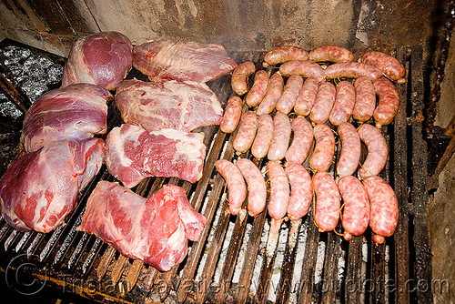 asado - meat and chorizo bbq, argentina, asado, barbecue, bbq, chorizo, grill, hostel clan, noroeste argentino, raw meat, sausages