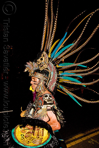 aztec dancer with feathers - dia de los muertos - halloween (san francisco), aztec, costume, day of the dead, dia de los muertos, face painting, facepaint, feathers, halloween, makeup, man, mexican, night