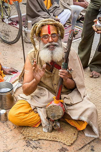 baba (hindu devotee) with musical instrument (nepal), baba, cross-legged, dreadlocks, hindu, hinduism, kathmandu, maha shivaratri, man, pashupatinath, ramanandi tilak, sadhu, sitting, tilaka, white beard