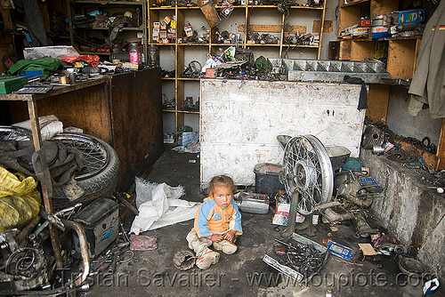 baby in motorcycle mechanic shop - keylong - manali to leh road (india), baby, child, girl, kid, motorcycle mechanic, motorcycle touring, road, shop, toddler, workshop