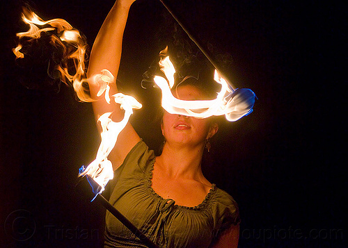 blinded by fire, double staff, fire dancer, fire dancing, fire performer, fire spinning, fire staffs, night, savanna, staves, woman