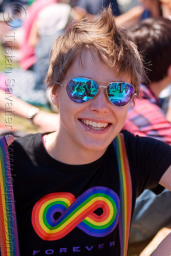 blue mirror sunglasses, blue sunglasses, gay pride festival, jess, lip piercing, mirror sunglasses, mohawk hair, rainbow colors, rainbow tshirt, woman