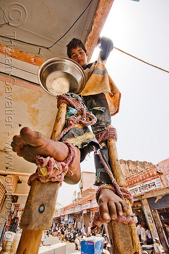 boy begging on stilts - jaipur (india), bare feet, barefoot, beggar, begging, boy, child, jaipur, pan handling, ropes, stilts, stiltwalker, stiltwalking, street kid