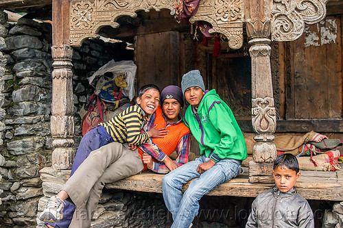 boys playing in front of old traditional house with wood carvings (india), boys, carved, children, columns, house, intricate, janki chatti, kids, knit cap, sitting, village, wood carving
