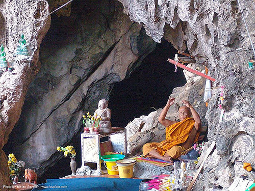 buddhist monk in natural cave - thailand, bhagwa, buddhist monk, cave mouth, caving, natural cave, saffron color, spelunking
