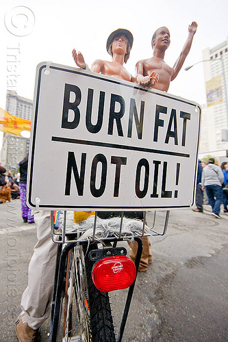 burn fat - not oil, bicycle, bike, black friday, demonstration, demonstrators, dolls, occupy, ows, protest, protesters, sign, union square