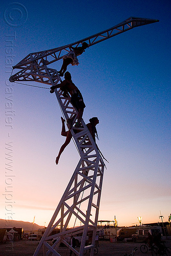 burning man - aerialists on "the heron", aerialists, arielle, backlight, christina sporrong, crane, dancing lady, steel, sunset, the heron project, truss
