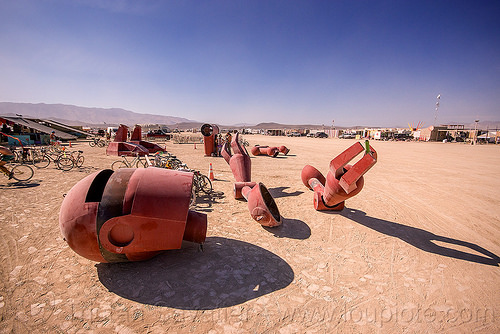 burning man - disassembling the big red robot - becoming human, art installation, becoming human, christian ristow, disassembled, dismembered, head, parts, red, robot, sculpture, statue, steel