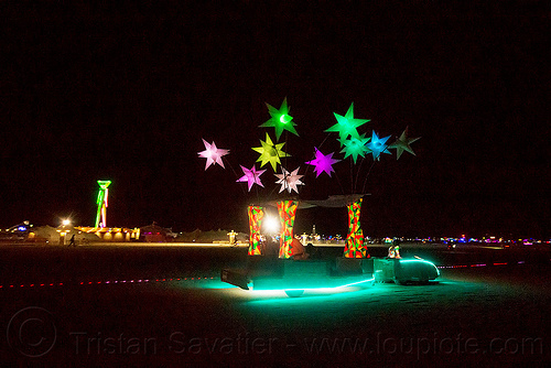 burning man - glowing art car with color stars - cool wind, burning man art cars, burning man at night, cool wind art car, glowing, inflatable stars, light stars, mutant vehicles