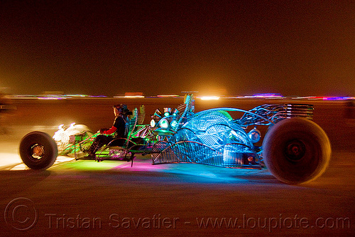 burning man - glowing dragster art car, art car, burning man art cars, burning man at night, dragster, glowing, henry chang, mr fusion, mutant vehicles