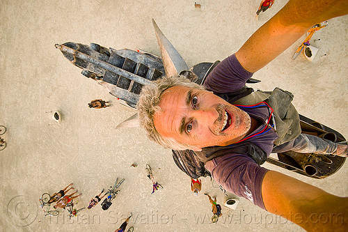burning man - in the mouth of the coyote, art installation, bryan tedrick, climbers, climbing, coyote sculpture, man, metal sculpture, self-portrait, selfie, statue