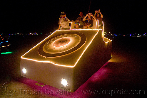 burning man - mobile phone - it's illegal to use a phone while driving, art car camp, burning man art cars, burning man at night, damon doherty, mobile phone, mutant vehicles, phonesaure, telephone