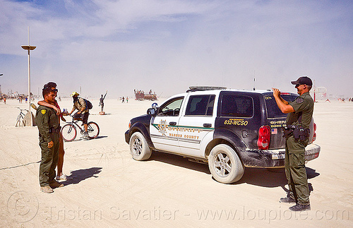 burning man - sheriff taking souvenir photo with naked man, cops, jumpsuits, law enforcement, leo, officers, photographer, police uniform, sheriff, suv, tactical uniform, taking photo