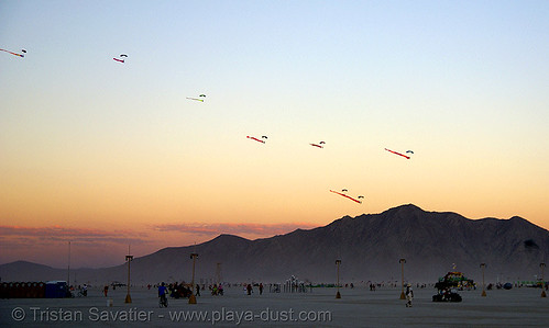 burning man - skydivers with eels in the sky at dusk, burning sky, dusk, eels, mountains, parachutes, parachutists, skydivers, skydiving