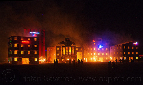 burning man - start of wall street fire, buildings, burning man at night, corporate logos, fire, frogbat, wall street
