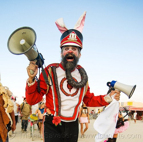 burning man - steven raspa is the uber bunny, leading the bunny march, attire, beard, bullhorns, bunnies, bunny ears, bunny march, burning man outfit, cap, color contact lenses, contacts, costume, hat, makeup, red, special effects contact lenses, steven raspa, theatrical contact lenses