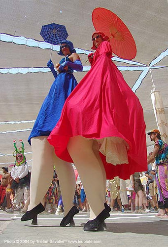 burning man - stiltwalkers in blue and red costumes with umbrellas, blue, costumes, girls, red, stilt walkers, stiltwalker, stiltwalking, women