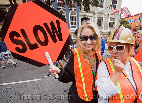 caltrans workers with stop sign, bay to breakers, caltrans, costume, footrace, high-visibility jacket, high-visibility vest, reflective jackets, reflective vest, safety helmet, safety jackets, slow sign, street party, woman, workers